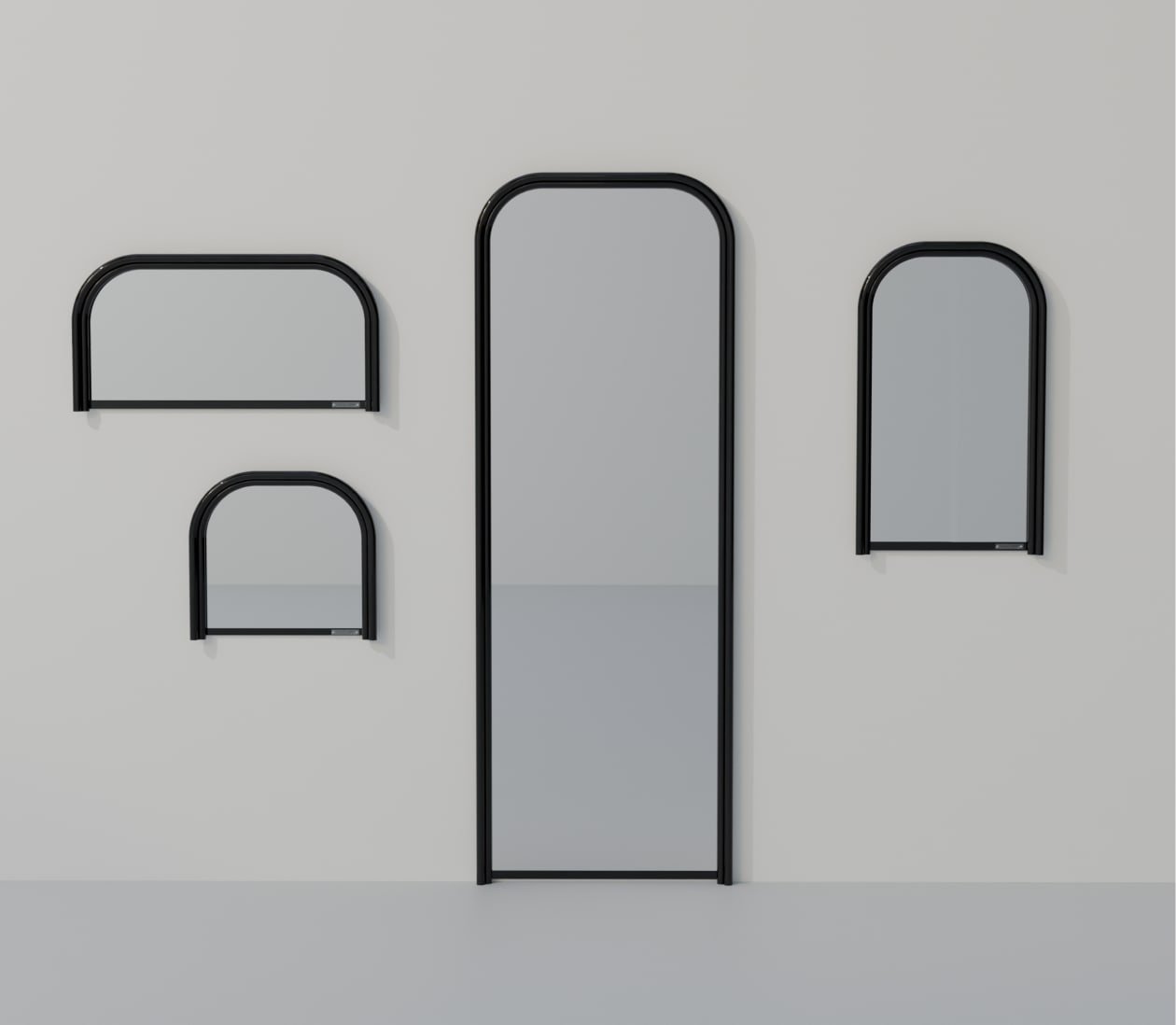 Quatre miroirs UD à cadre noir présentés ensemble sur fond gris